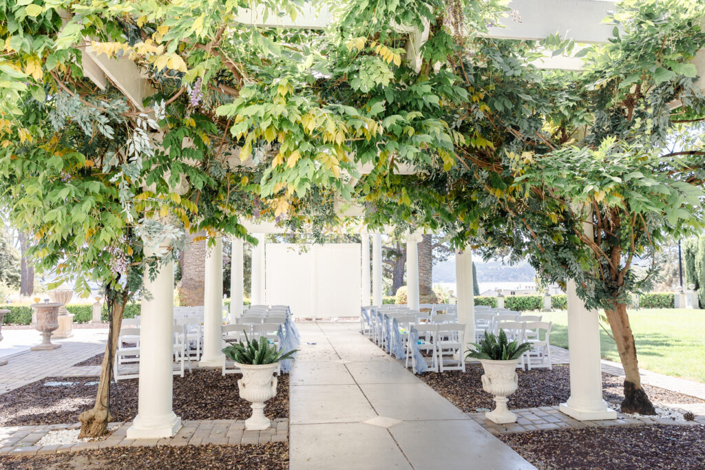 Ceremony with hanging wisteria at Jefferson street Mansion Benicia California captured by sacramento wedding photographer