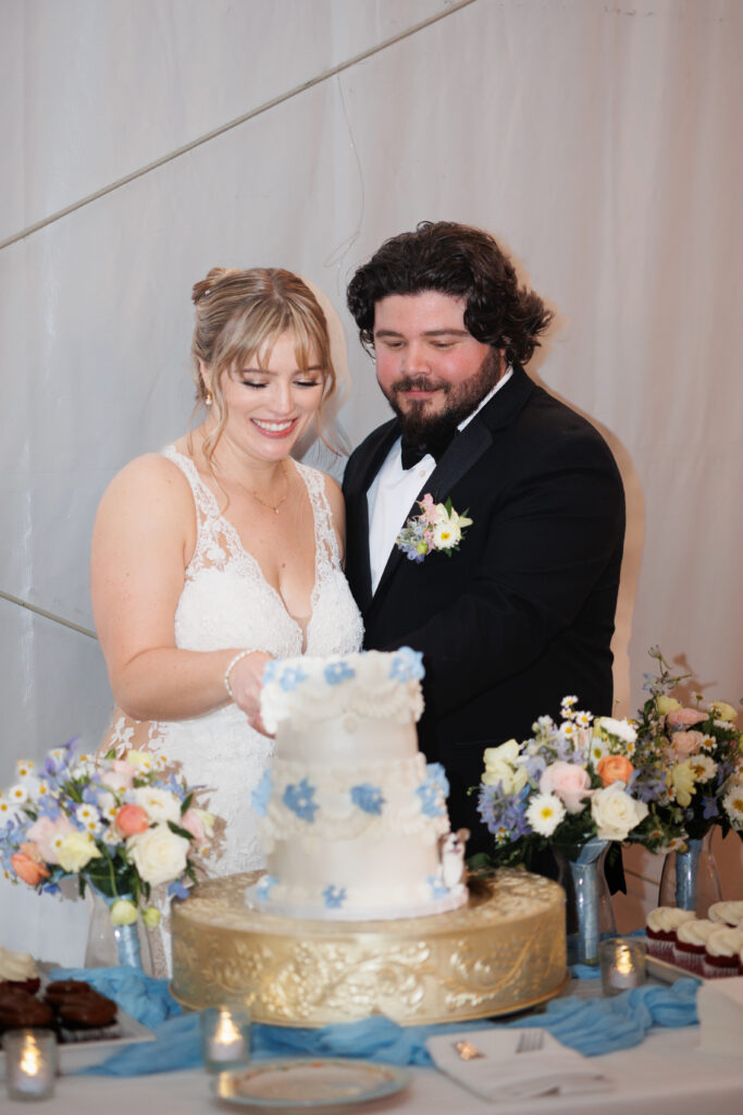 bride and groom cut cake at jefferson street mansion captured by sacramento wedding photographer