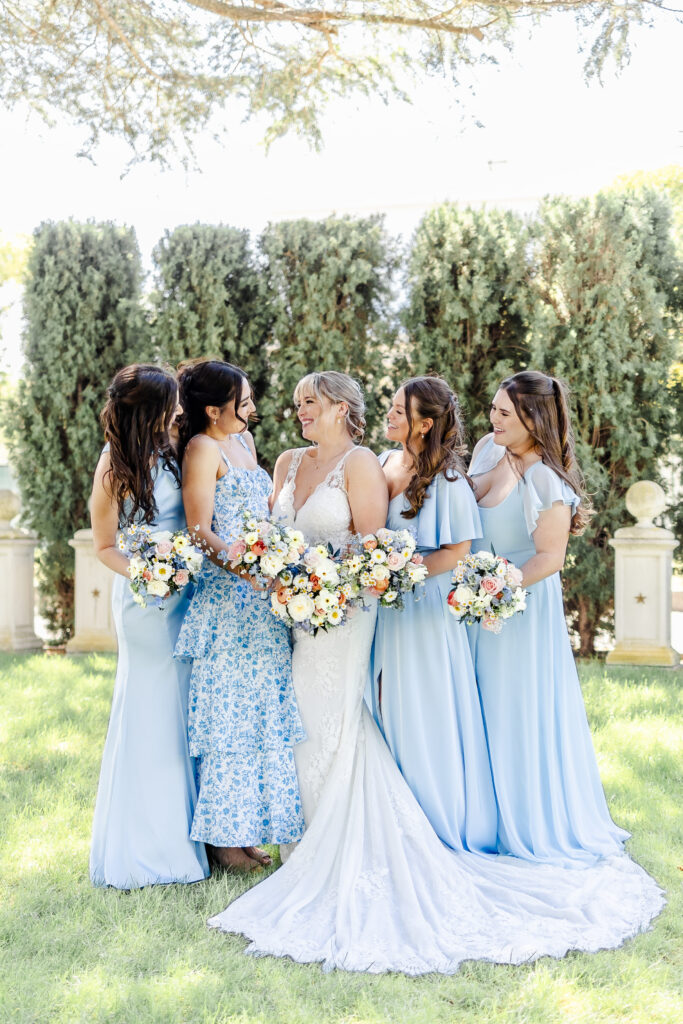 bridesmaids in powder blue at jefferson street mansion captured by sacramento wedding photographer
