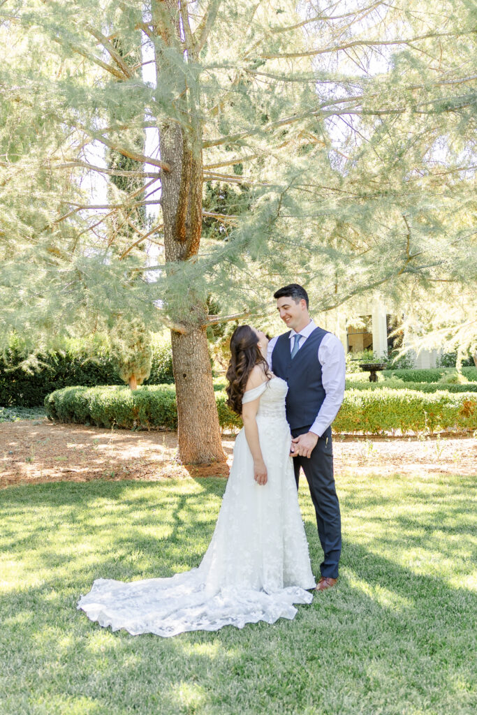Bride and Groom pose on the Lawn at Park Winters Wedding captured by Sacramento Wedding Photographer