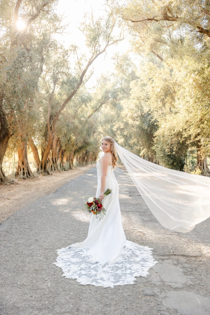 Bride stands in the entrance of the Maples Woodland an elegant wedding venue captured by a sacramento wedding photographer