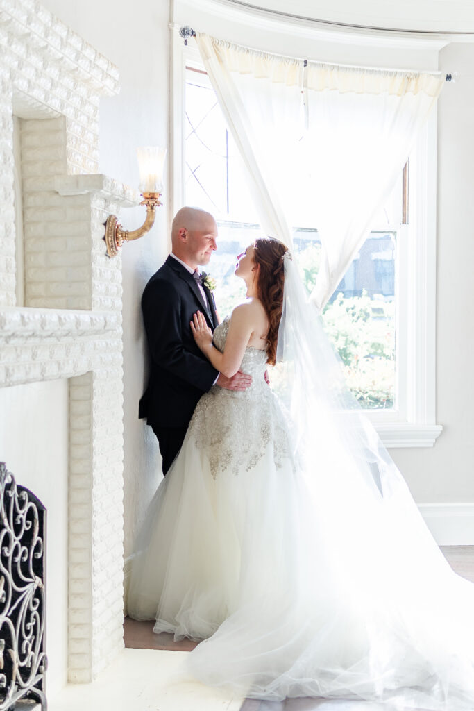 bride and groom capture some portraits in the main living room of vizcaya wedding venue captured by a sacramento wedding photographer