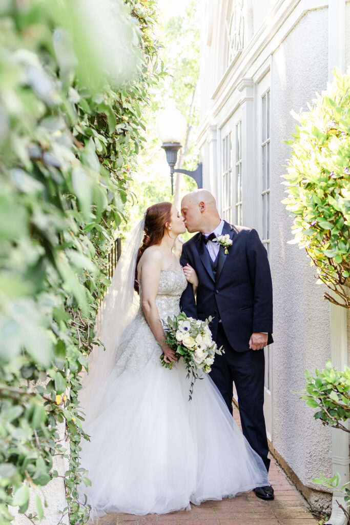 Bride and groom share kiss during Golden Hour at vizcaya wedding venue captured by a sacramento wedding photographer
