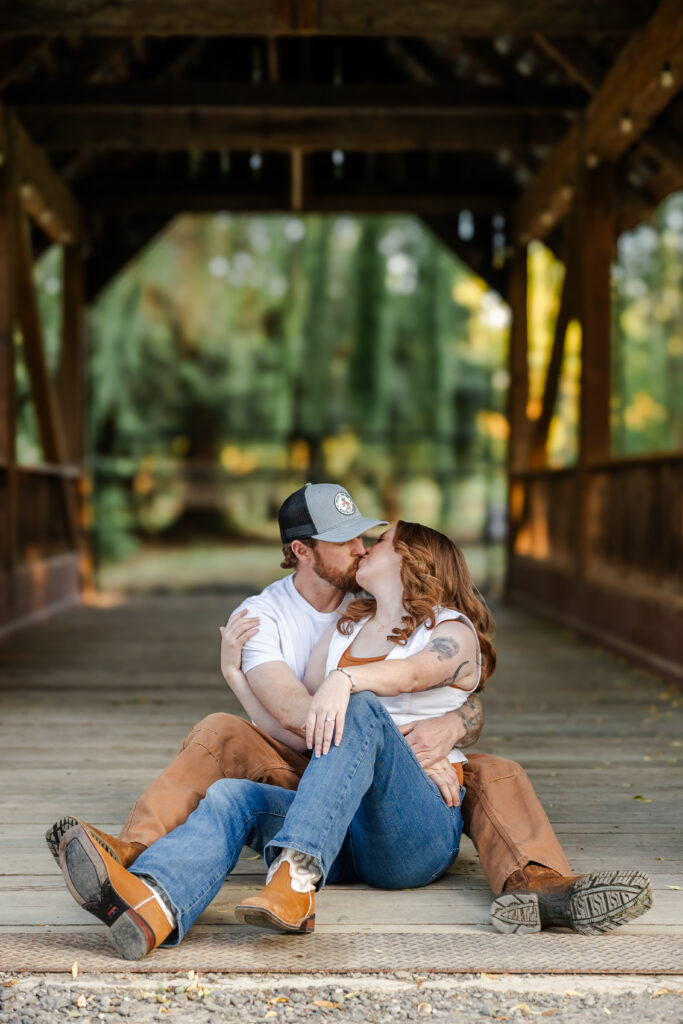 Couple shares a kiss during their barn styled sacramento engagement session
